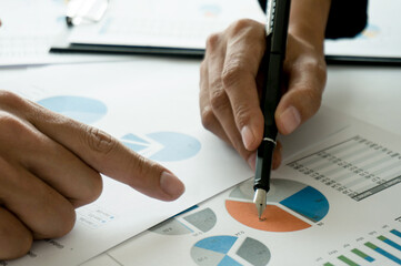 Team leader coach teach young workers explain on paper for business plan listen talkative coworker and discussing new project presentation Serious professional advisor consulting