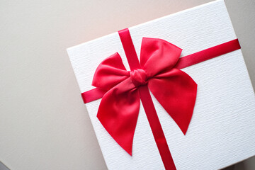 Valentine present. Gift box and red ribbon for romantic couple.Gift box and ribbon with tag for valentine present