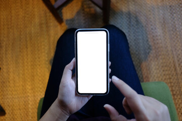 Women's hands holding cell telephone blank copy space screen. smart phone with technology concept.