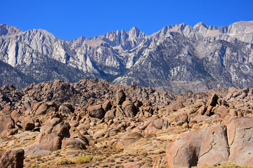 Mount whitney and the eastern sierras  with the wildly eroded alabama hills rock formations a sunny fall day  near lone pine, california