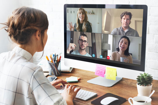 Woman on video call in workspace with computer