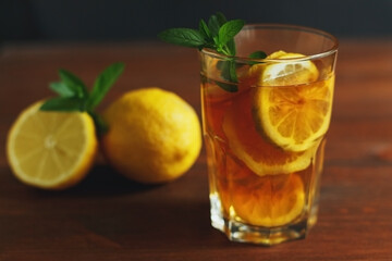 Traditional iced tea with lemon and ice in tall glasses. Summer drink