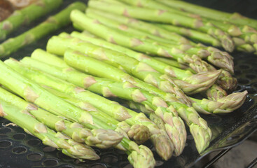 Fresh From Garden Organic Asparagus Cooking on Grill