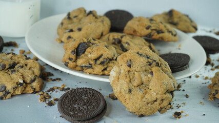 Selective focus of homemade oreo softcookies with some oreos as a garnish on white ceramic plate