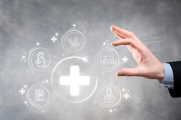 Businessman hold virtual plus medical network connection icons. Covid-19 pandemic develop people awareness and spread attention on their healthcare.Doctor,document,medicine,ambulance,patient icon.