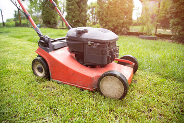 Lawn mover on green grass. Machine for cutting lawns.