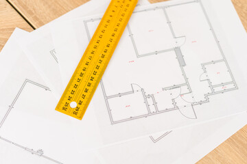 Architect working on blueprint. Architects workplace - architectural project, blueprints, ruler, calculator, laptop and divider compass. Construction concept. Engineering tools