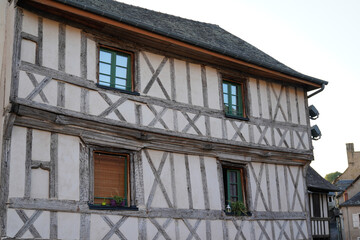 typical half-timbered house in the center of donzenac village in creuse