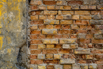 Brick wall texture, loft style, destruction of concrete and stone, antiquity corrosion, foundations of building floors, chips, cracks