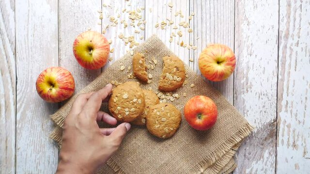 Crunchy sweet apple oat cookies on table 