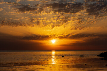 Naklejka na ściany i meble Sunrise over the sea and beautiful cloudscape in Anapa