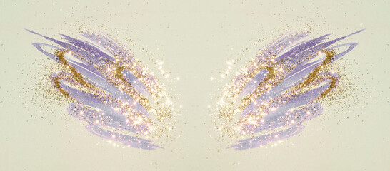 Golden glitter on abstract blue watercolor wings in vintage nostalgic colors