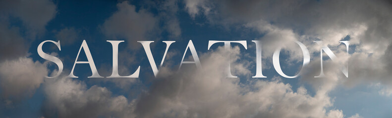 Abstract religious concept. Salvation in the air. Symbolic word inscibed amongst clouds on a dark blue sky.