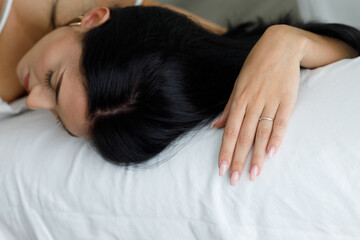 Exhausted young woman passed out sleeping in close up