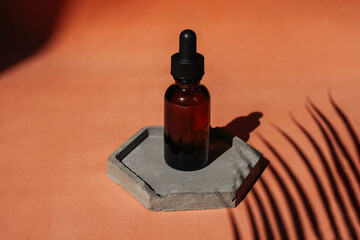 Front view of amber face serum bottle.