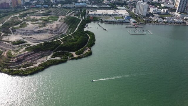Aerial view boat move over rubbish dump site Jelutong