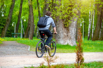 Fototapeta premium Cyclist ride on the bike path in the city Park 