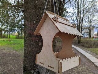 birdhouse hanging on a tree in the spring season