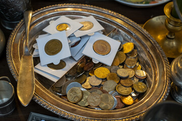Collection of coins on stall at market