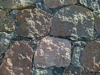 texture of the facade of a building made of old stones