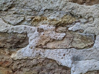 texture of the facade of a building made of old stones