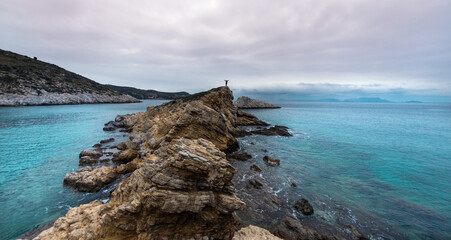 silhouette of a man with a backpack on the mountain