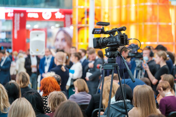 Video camera recording business conference
