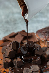 Chocolate on the dark background. World Chocolate Day concept