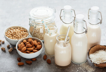 Alternative types of vegan milks in glass bottles
