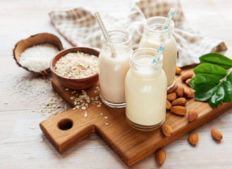 Alternative types of vegan milks in glass bottles