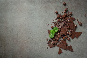 Chocolate on the dark background. World Chocolate Day concept
