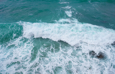 Fototapeta na wymiar view of ocean waves and a fantastic rocky shore