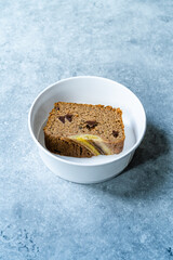 Homemade Organic Take Away Healthy Banana Bread Cake Slices with Chocolate Pieces in Take Out Plastic Bowl.