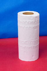 Roll of paper napkins on a colored background close-up