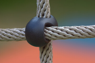 A fragment of the rope netting on the playground