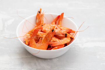 boiled gresh tasty shrimps in small white bowl