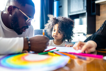 cute curly afro hair girl drawing with her dad parents positive education tolerance