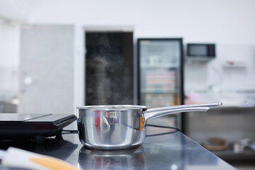 A dish in a saucepan is prepared on an electric stove