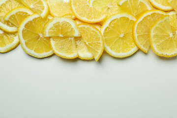 Ripe lemon slices on white background, space for text