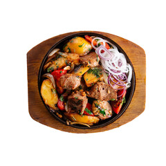 Isolated roast meat and potatoes on white background