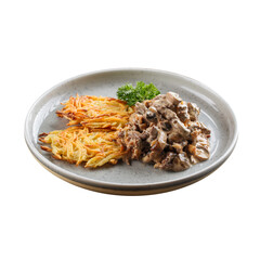 Isolated plate of potato pancakes with mushrooms and meat