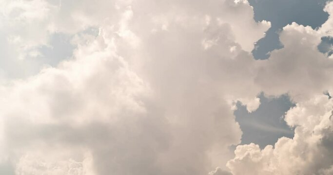 Bright cumulus clouds time lapse close up view of the sky.