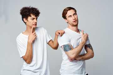 emotional men in white t-shirts antics fun isolated background