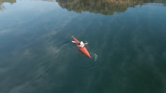 4K Drone footage of young  Indian kayaking in a misty lake in Kotagiri, Nilgiris, Chennai Tamil Nadu, India 60FPS for slow motion