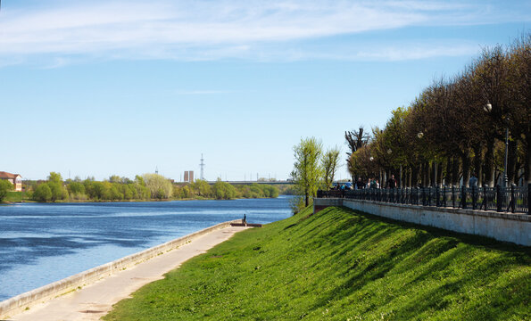 TVER, Russia, May 2021: Stepan Razin Embankment on the Volga river in Tver. View of the bridge from the Volga River embankment on a sunny day.