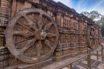 Fototapeta na wymiar The famous chariot wheels architecture at ancient 13th century Sun temple in Konark, Odisha, India.