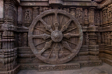 Fototapeta na wymiar The famous chariot wheels architecture at ancient 13th century Sun temple or Surya Mandir in Konark, Odisha, India.