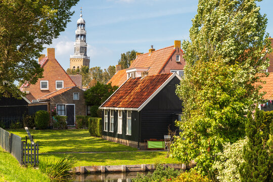 View of the church tower of the small picturesque town of Hindeloopen in Friesland, The Netherlands.
