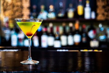 Martini cocktail placed on the bar counter in the restaurant.