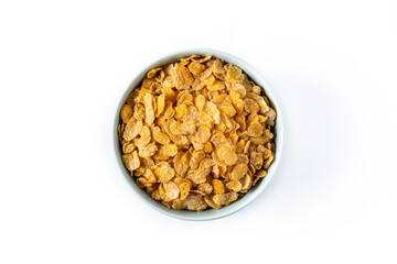 Corn flakes in a blue bowl isolated on white background. Top view